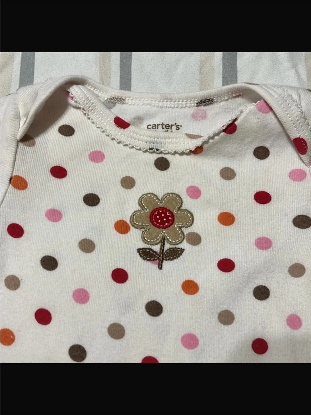 Carter's Polka-Dot long sleeved onesie with flower on chest, snaps